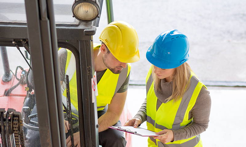 Workers talking with safety equipment